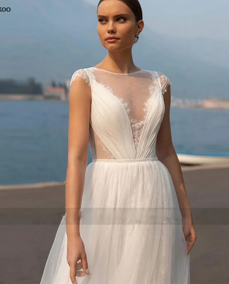 Principessa Beach Abiti da sposa per le donne Pizzo Tulle Illuison Cap Sleev